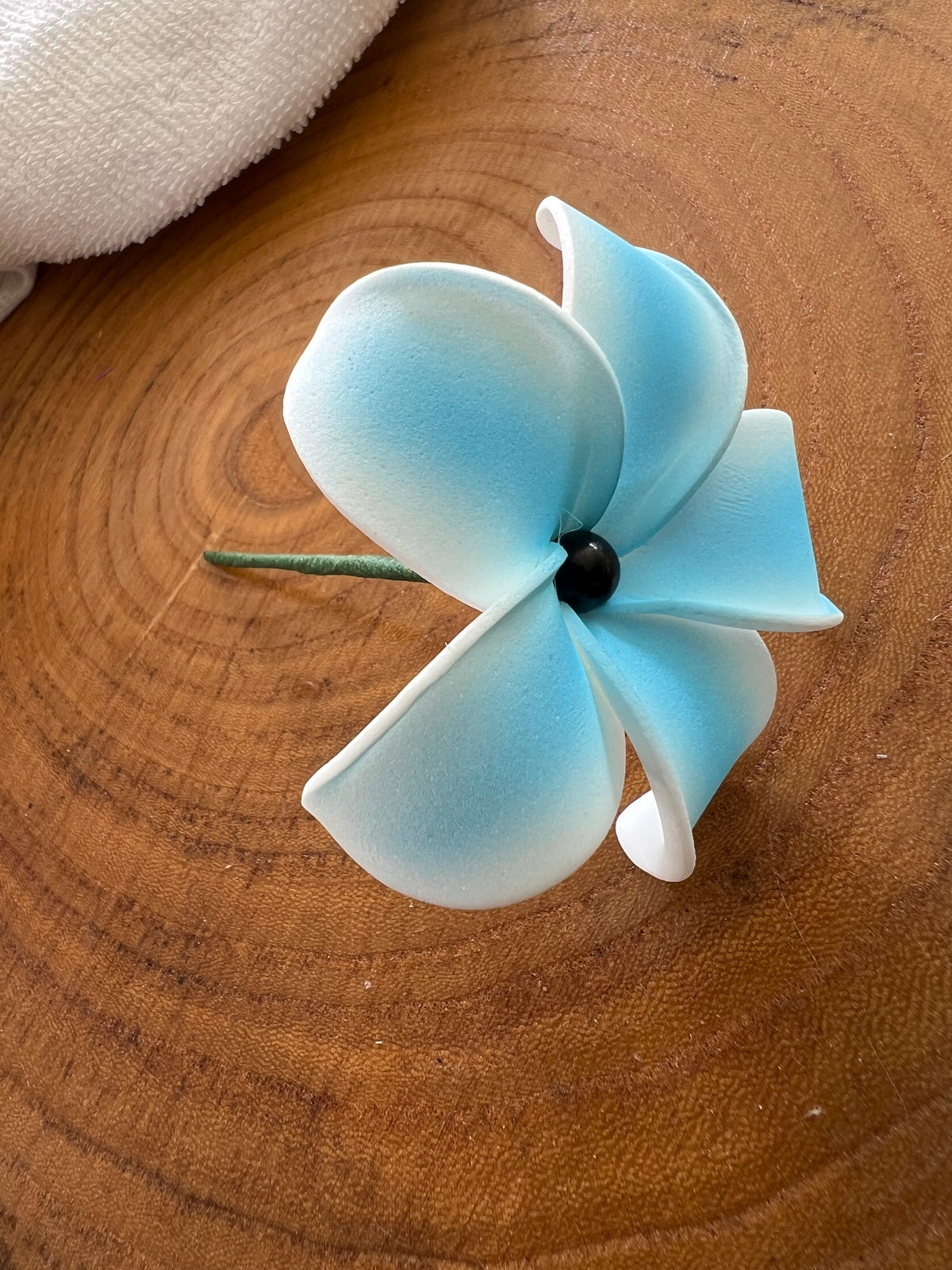Blue plumeria with black pearl